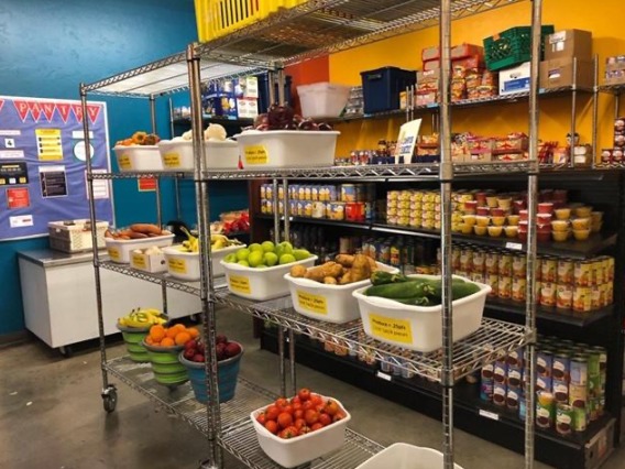 An inside view of the campus pantry showing shelves of fresh food